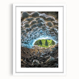 Framed landscape artwork depicting a serene cave scene, featuring a white mat and sleek black frame, ideal for modern home decor and art enthusiasts.