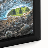 Close-up view of a framed canvas artwork depicting a serene landscape with intricate cave formations, featuring earthy tones and detailed textures, perfect for home decor.