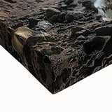 Close-up of a stretched canvas artwork depicting an abstract landscape with intricate cave formations in earthy tones, perfect for enhancing modern home decor.