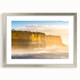 Framed landscape artwork depicting majestic cliffs, presented in a sleek silver frame with a mat, perfect for enhancing modern home decor and interior design aesthetics.