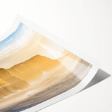 Stunning landscape print showcasing majestic cliffs against a vibrant sunset, featuring rich colors and intricate details, rolled and ready for framing or display.