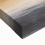 Close-up of a vibrant stretched canvas artwork depicting dramatic cliffs and landscapes, showcasing intricate details and rich colors ideal for home decor.