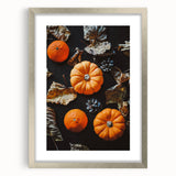Textured abstract art print depicting autumnal hues on a silver-framed canvas, suitable for bedroom decor.