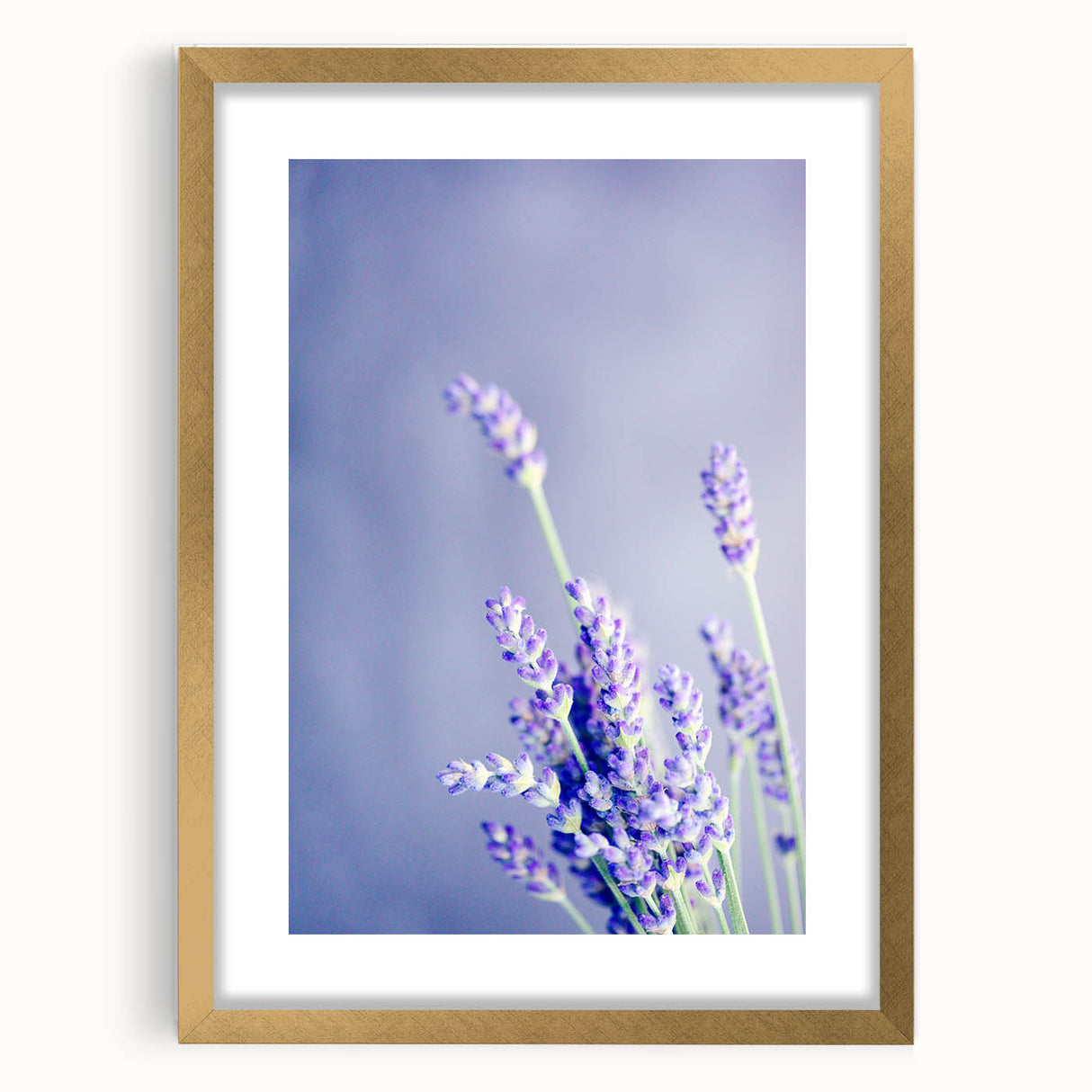 Abstract art print depicting spring with textured strokes in green and gold on a large framed canvas.