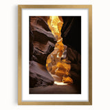 Elegant gold-framed landscape artwork depicting a serene cave scene, featuring intricate details and a classic mat design, perfect for enhancing interior decor.