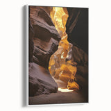 Framed canvas artwork showcasing a stunning landscape with intricate cave details, featuring a white frame that enhances the visual appeal, perfect for home decor.