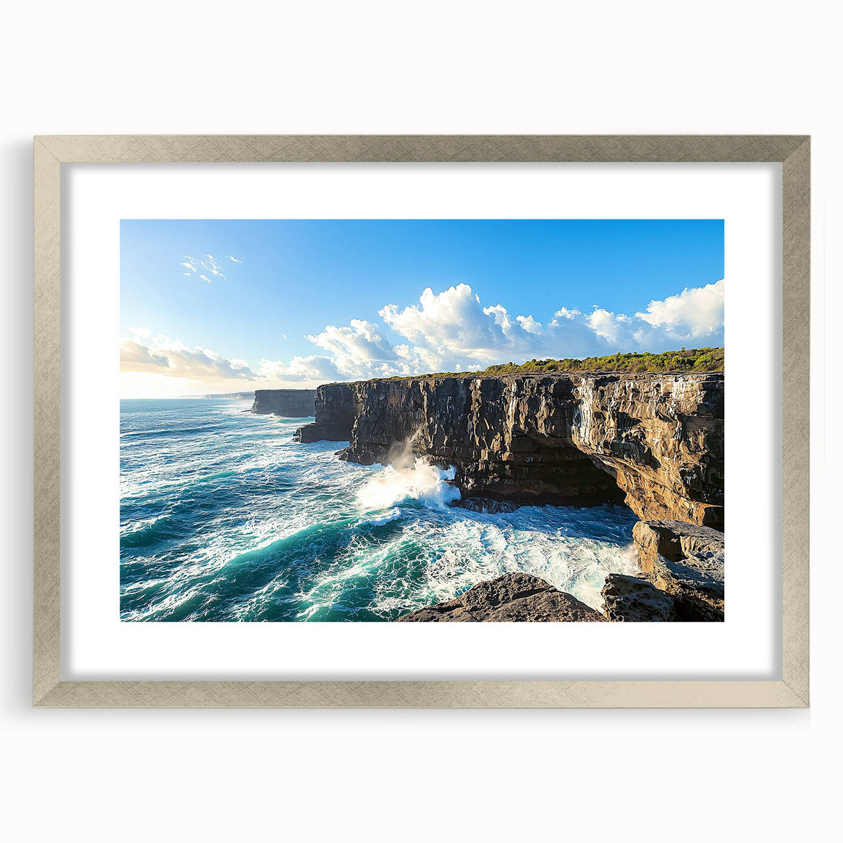 Framed landscape artwork depicting majestic cliffs, elegantly bordered with a silver mat, showcasing vibrant colors and intricate details for a stunning decor accent.