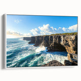 Framed canvas artwork depicting a serene landscape with towering cliffs and vibrant greenery, presented in a white frame, enhancing home decor aesthetics.