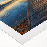 Rolled canvas artwork showcasing a vibrant landscape bridge design, featuring intricate details and rich colors, securely packaged in a protective cardboard tube for safe delivery.