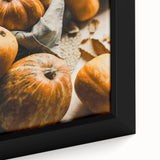 Close-up of a large framed canvas featuring textured black wall art with colorful abstract designs.