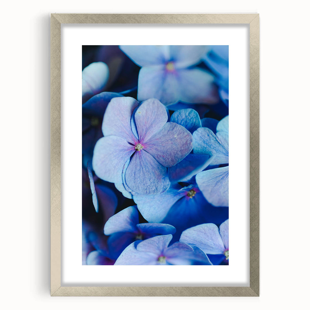Textured abstract art print featuring soft pastel hues on a silver-framed canvas, ideal for bedroom decor.