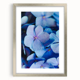 Textured abstract art print featuring soft pastel hues on a silver-framed canvas, ideal for bedroom decor.