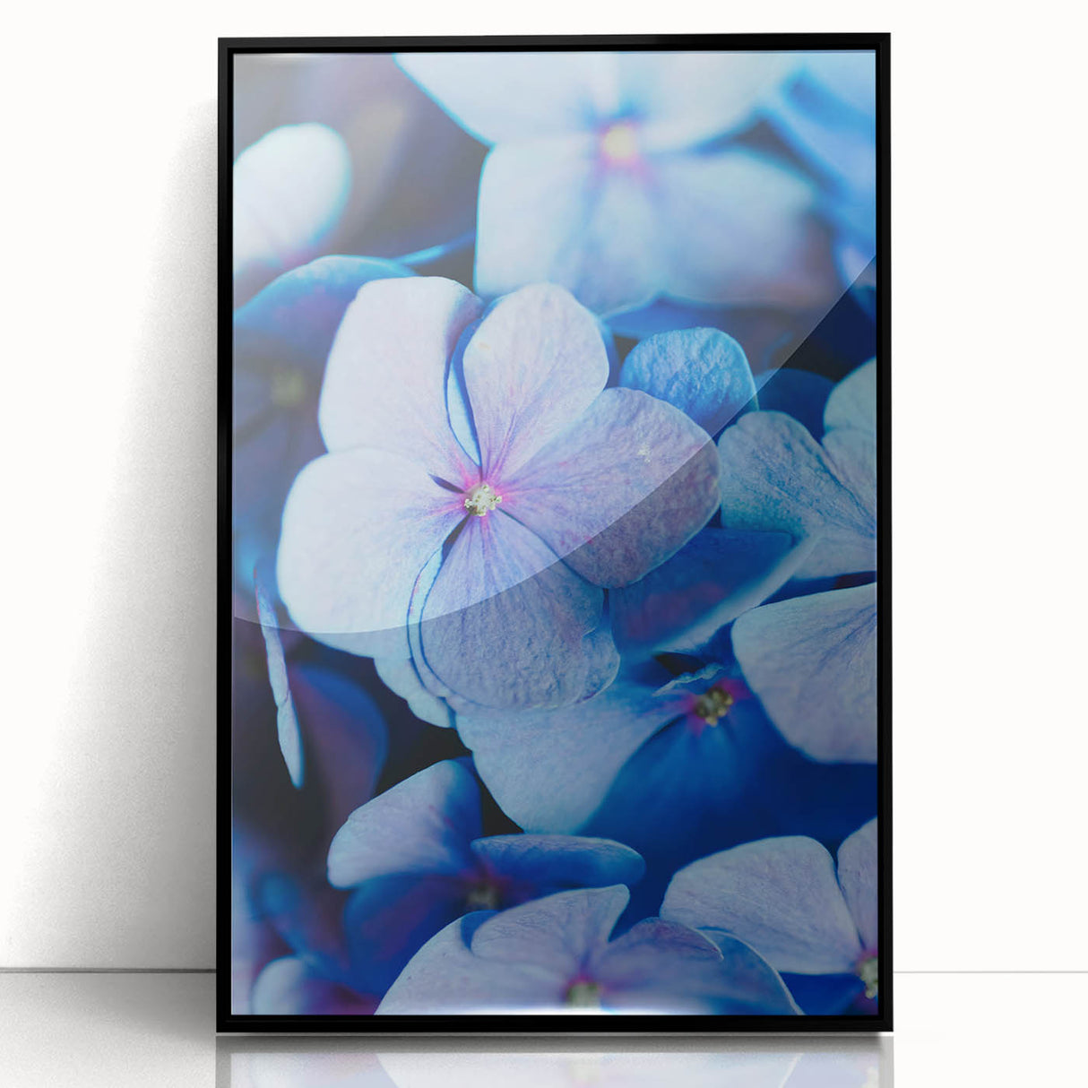 Large abstract wall art in spring-themed colors on acrylic, framed in black, ideal for modern living room decor.