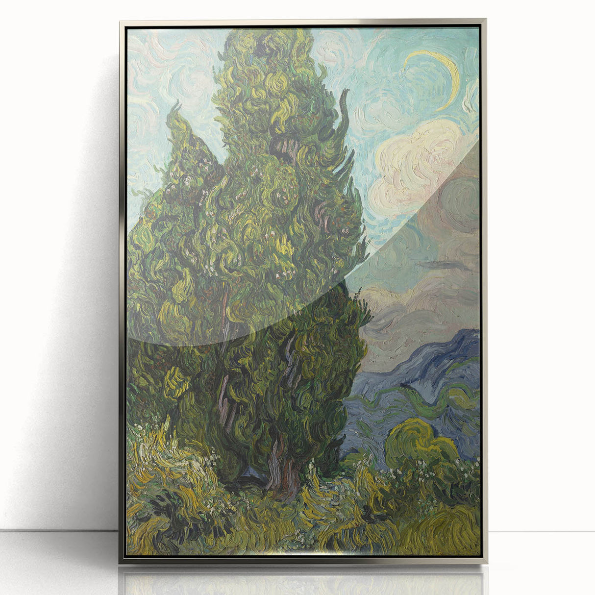 Large art print of Van Gogh's Starry Night in a silver frame, featuring vibrant blue and yellow swirls.