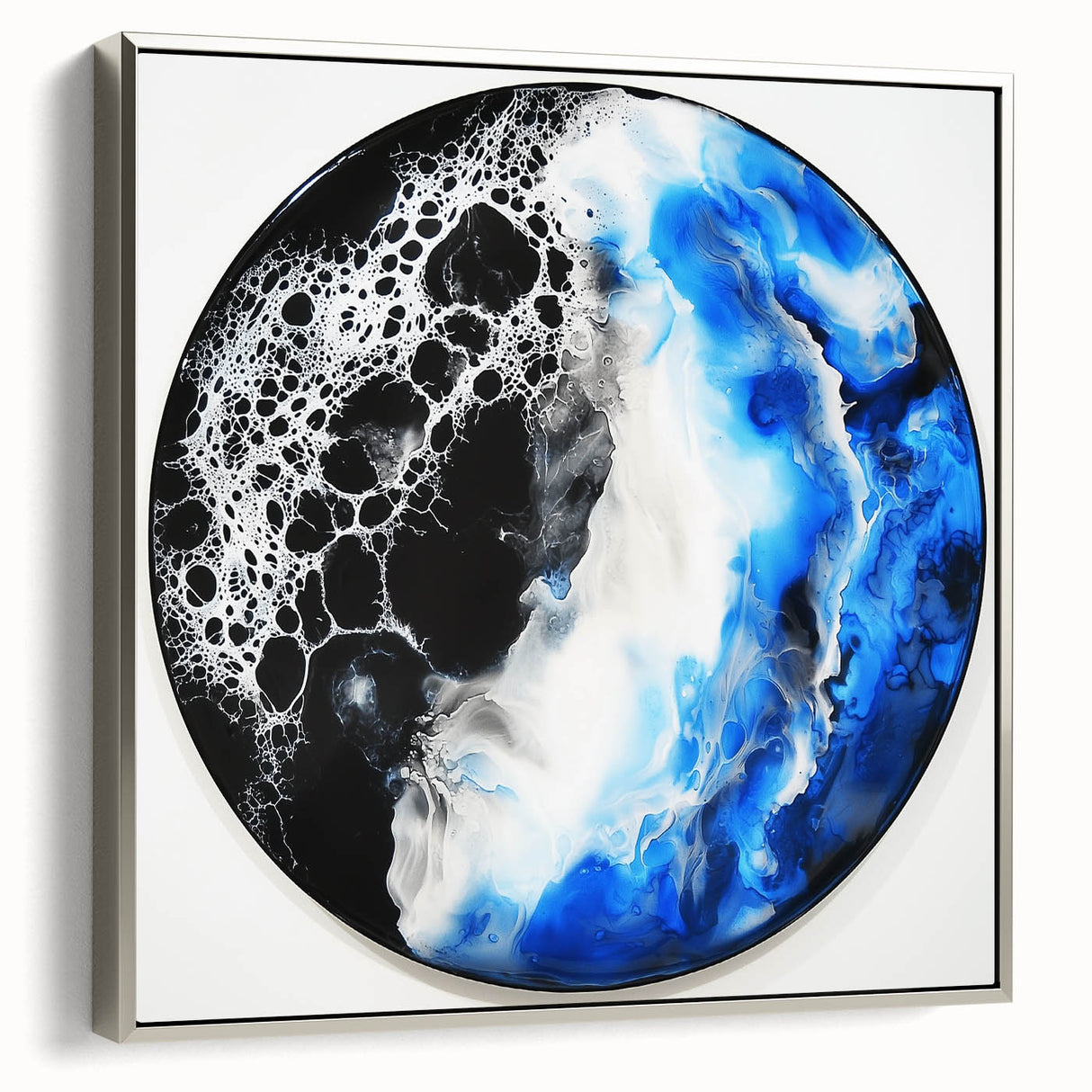 Abstract geometric framed canvas artwork in silver, showcasing a modern design with sharp angles and lines, set against a neutral background. Perfect for contemporary home decor.