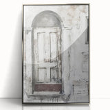 Mid-century modernist acrylic print of a rustic Italian door in muted earth tones, framed in silver.