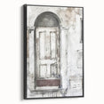 Framed canvas featuring a black and white photo of a rustic Italian door, ideal for bedroom wall art.