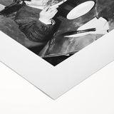 Art deco poster on rolled canvas featuring a stylized depiction of people dining, with muted earth tones.