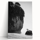 Stretched landscape canvas art featuring a vibrant, abstract design with shades of blue, green, and yellow, leaning against a neutral wall, perfect for modern decor.