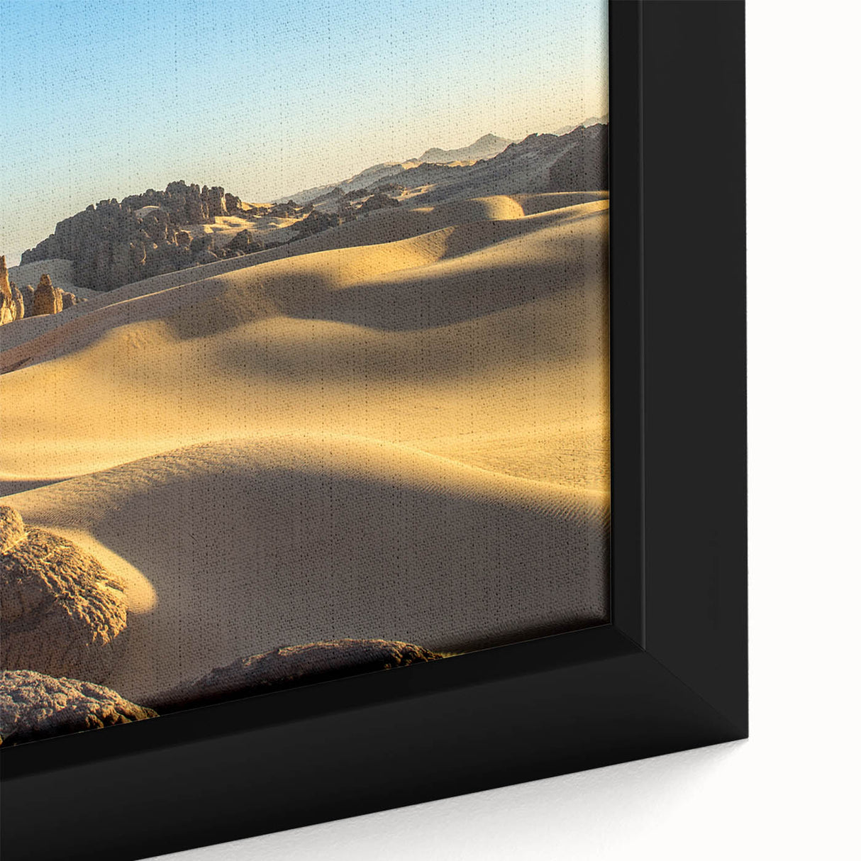 Extra large framed canvas featuring a textured depiction of an Algerian landscape in black with colorful accents.