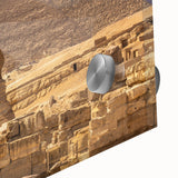 Large abstract wall art of an Egyptian landscape in muted earth tones on acrylic glass, ideal for dining room decor.