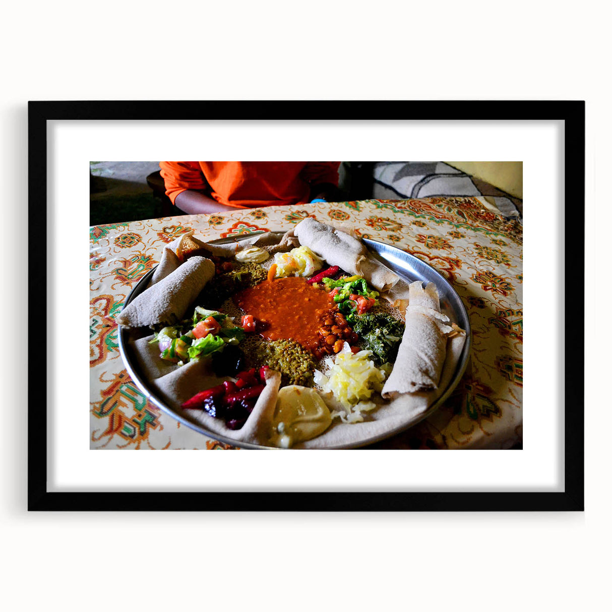 Extra large abstract art print depicting a colorful Ethiopian landscape on textured canvas, framed in black.