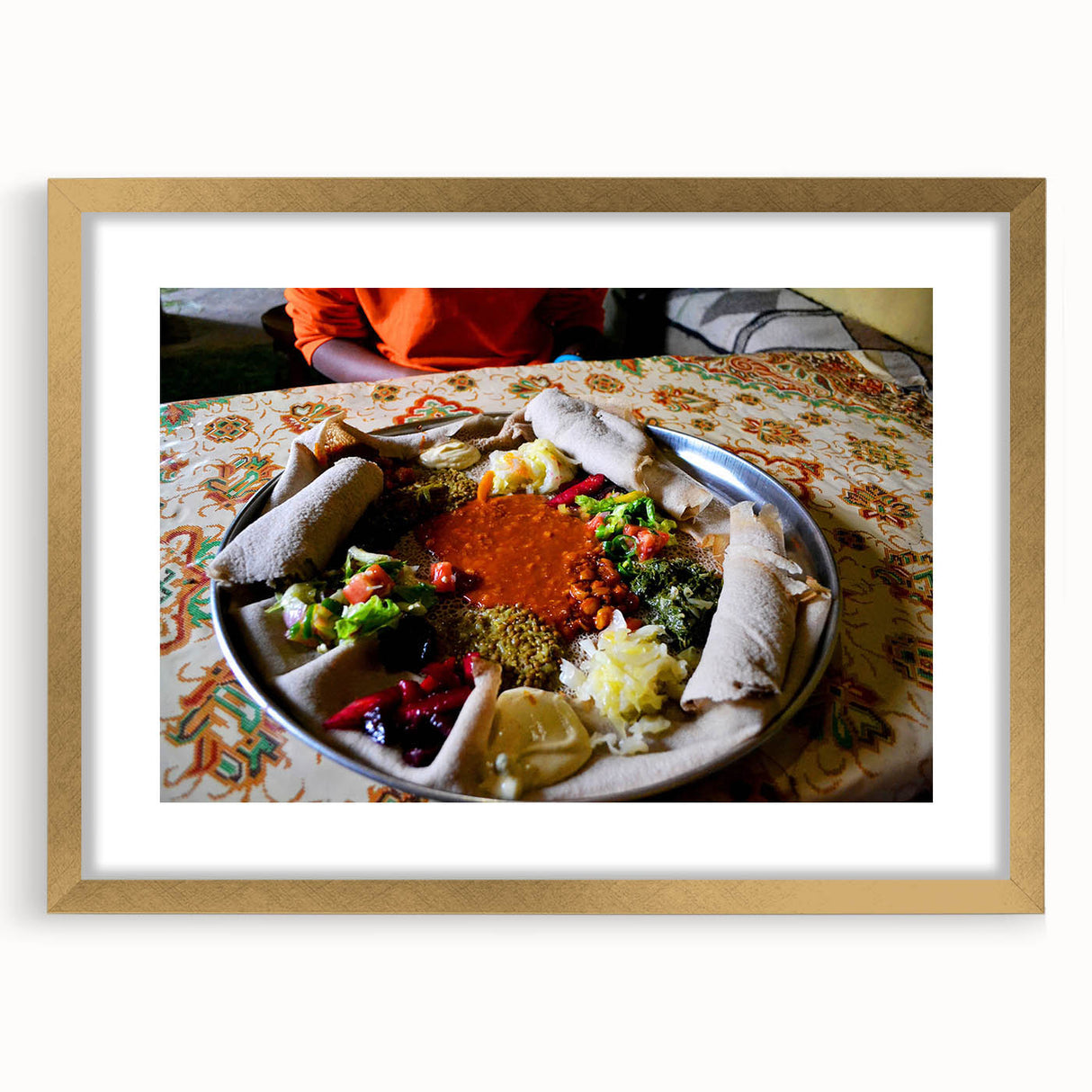 Textured abstract art print depicting an Ethiopian landscape in earthy tones, framed in gold, suitable for bedroom decor.