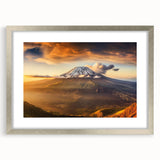 Abstract art print of a Kenyan landscape in muted earth tones on a framed silver mat, suitable for dining room decor.