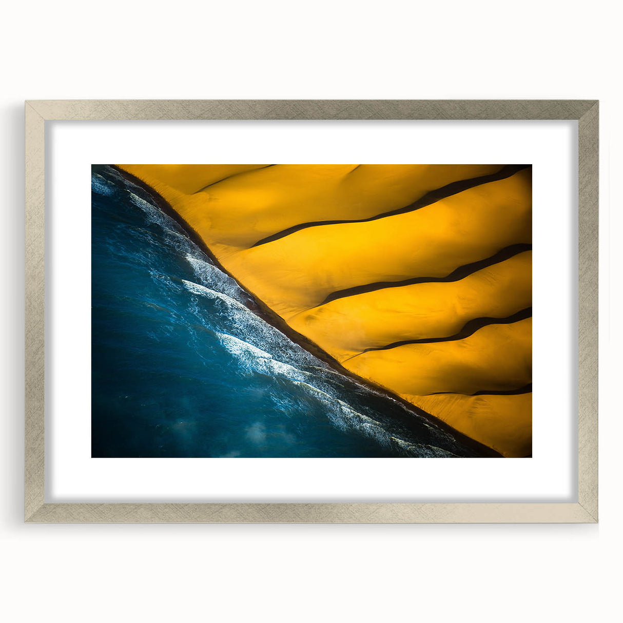 Abstract art print of an African landscape in muted earth tones, framed in silver, suitable for dining room decor.