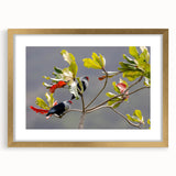 Abstract art print of Seychelles landscape in muted gold and blue tones, framed with a gold mat.