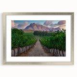 Textured abstract art print depicting an African landscape in muted earth tones on a framed silver mat.