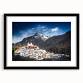 Extra large abstract art print depicting a vibrant, colorful Tibetan landscape on a textured canvas, framed in black.
