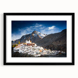 Extra large abstract art print depicting a vibrant, colorful Tibetan landscape on a textured canvas, framed in black.