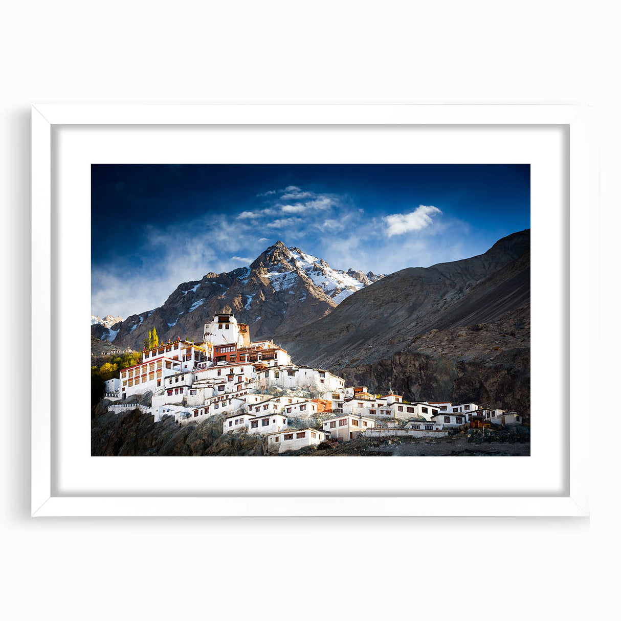 Abstract art print of a Tibetan landscape in muted earth tones on a framed white mat, suitable for dining room decor.