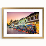 Extra large abstract art print depicting a textured scenery of Laos, in muted earth tones, framed in gold.