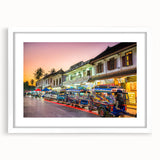 Abstract art print depicting a serene Laos landscape in soft blue and green tones, framed with a white mat.