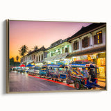 Landscape painting of a serene Laotian setting on a framed canvas, featuring muted gold and black tones.