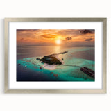 Textured art depicting an abstract Maldives scenery in muted blue and white tones, framed with a silver mat.