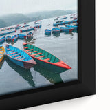 Framed canvas featuring a textured depiction of a Nepalese landscape in black with colorful accents.