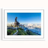 Abstract art print of a Vietnamese landscape in muted greens and blues on a framed white canvas.