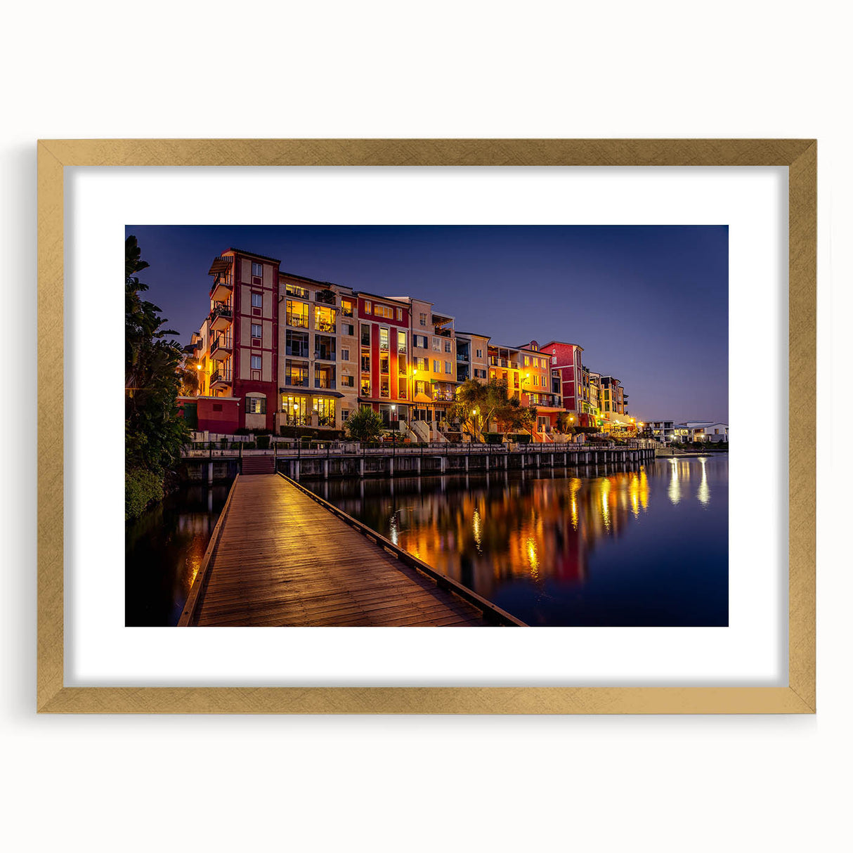 Abstract art print depicting Queensland scenery in muted earth tones, framed in gold, suitable for dining room decor.