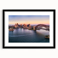 Extra large abstract art print of Sydney scenery in vibrant colors on a textured canvas, framed in black.