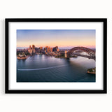Extra large abstract art print of Sydney scenery in vibrant colors on a textured canvas, framed in black.