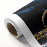 Art deco poster of British Columbia scenery on rolled canvas, featuring muted green and blue tones.