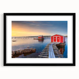 Abstract art print of a vibrant, colorful Newfoundland scenery on a large framed canvas with black mat.