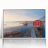 Acrylic print of a serene Newfoundland landscape, featuring muted greens and blues, in a white frame.