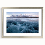 Textured art of abstract Yukon scenery in muted earth tones, framed with a silver mat, ideal for bedroom art.