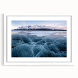 Abstract art print of Yukon scenery in muted earth tones on a framed white mat, ideal for dining room decor.