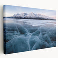 Snow-covered Yukon landscape on large stretched canvas, featuring muted white and blue tones, suitable for kitchen wall art.