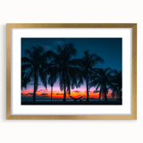 Textured abstract art print of Caribbean scenery in a gold frame, featuring muted ocean and sky tones.